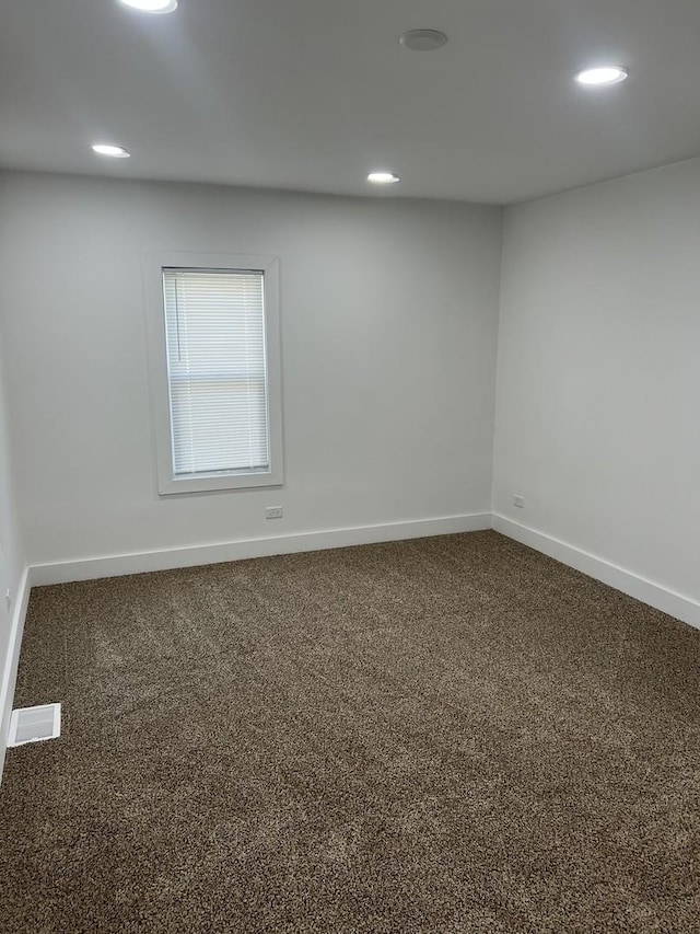 spare room with baseboards, carpet, and recessed lighting