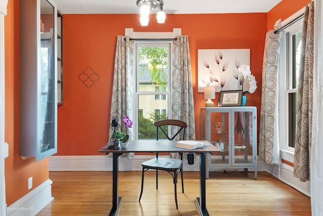 interior space featuring wood finished floors and baseboards