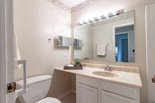 bathroom featuring vanity, tile patterned flooring, and toilet