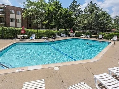 pool featuring a patio area and fence