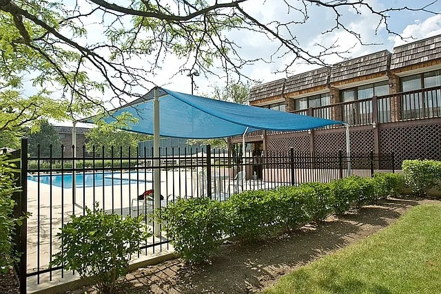 view of swimming pool with a fenced in pool and fence