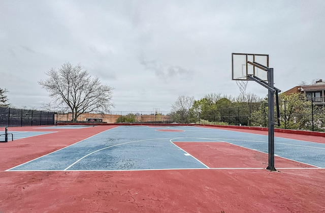 view of sport court featuring fence and community basketball court