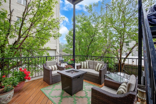 937 N Willard Ct Unit 1, Chicago, IL 60642 - wooden deck featuring an outdoor living space with a fire pit