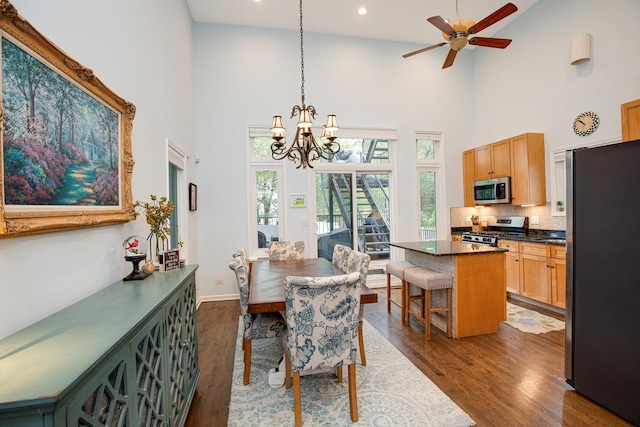 937 N Willard Ct Unit 1, Chicago, IL 60642 - dining space featuring high vaulted ceiling, dark wood finished floors, a chandelier, ceiling fan, and recessed lighting