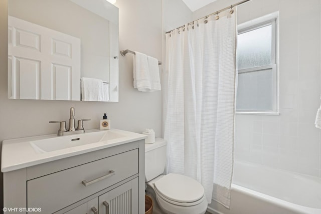 full bathroom with shower / bath combo with shower curtain, toilet, and vanity