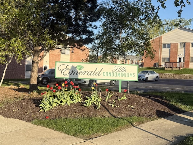 community sign with uncovered parking