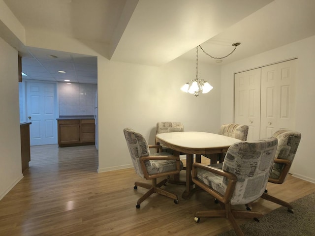 10160 Lancaster Dr, Mokena, IL 60448 - dining area featuring a chandelier, wood finished floors, baseboards, and recessed lighting