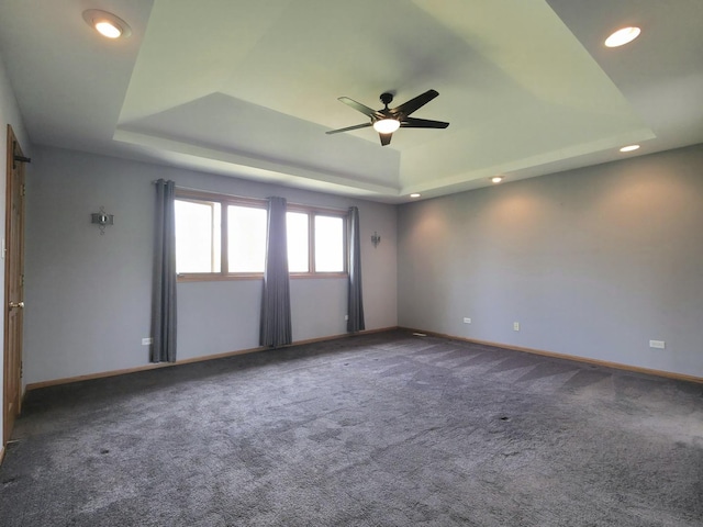 10160 Lancaster Dr, Mokena, IL 60448 - spare room featuring a tray ceiling, baseboards, a ceiling fan, and recessed lighting