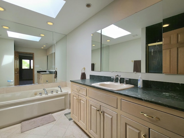 10160 Lancaster Dr, Mokena, IL 60448 - full bathroom featuring a skylight, marble finish floor, vanity, recessed lighting, and a bath