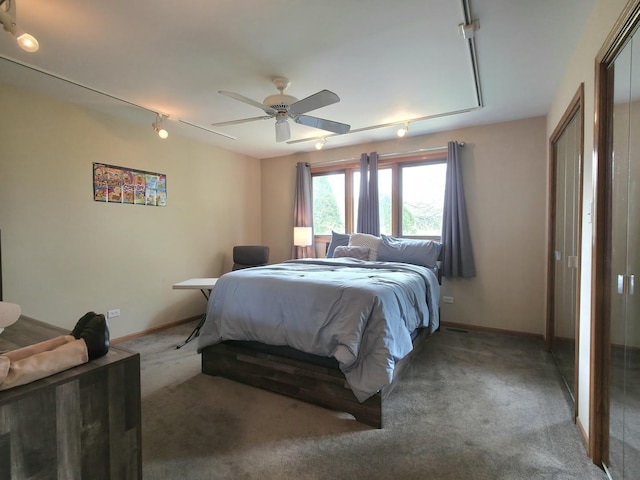 10160 Lancaster Dr, Mokena, IL 60448 - bedroom with rail lighting, light carpet, ceiling fan, and baseboards
