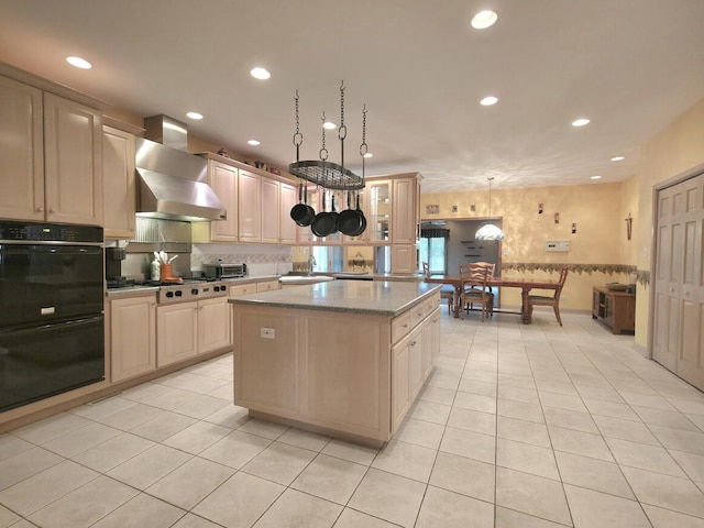 10160 Lancaster Dr, Mokena, IL 60448 - kitchen with gas stovetop, a sink, dobule oven black, wall chimney range hood, and a kitchen island