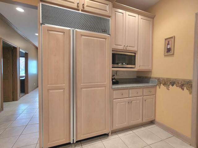 10160 Lancaster Dr, Mokena, IL 60448 - kitchen featuring built in appliances, ornamental molding, light countertops, and light tile patterned floors