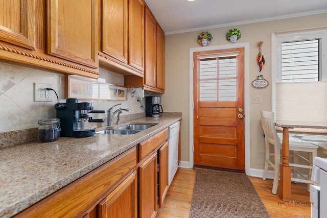 7220 W Ibsen St, Chicago, IL 60631 - kitchen with a sink, light stone countertops, backsplash, light wood-style flooring, and brown cabinetry
