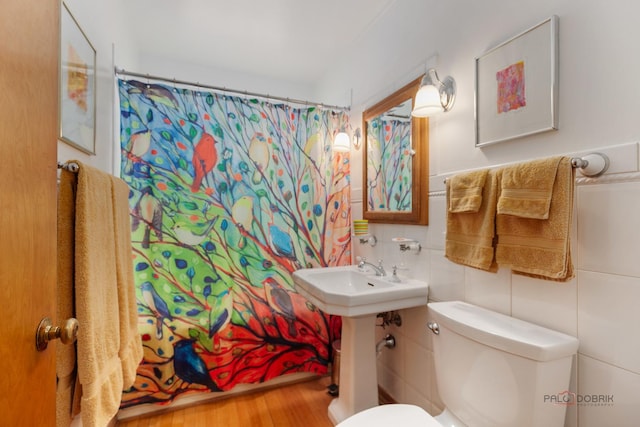7220 W Ibsen St, Chicago, IL 60631 - full bath with tile walls, toilet, a shower with curtain, and wood finished floors
