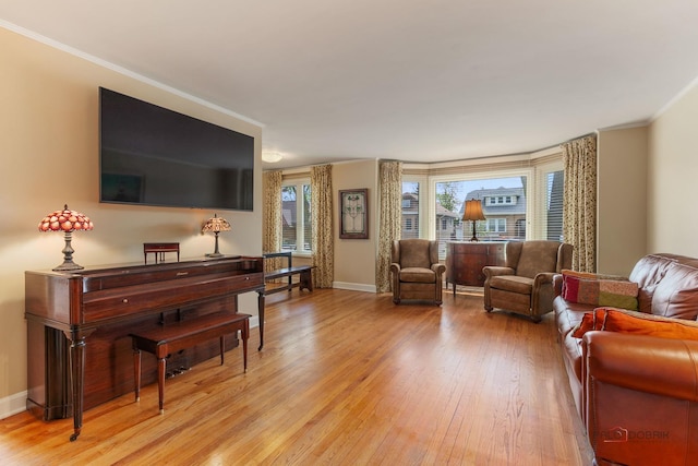 7220 W Ibsen St, Chicago, IL 60631 - living area with light wood-style floors, crown molding, and baseboards