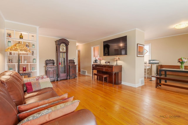 7220 W Ibsen St, Chicago, IL 60631 - living room featuring light wood-style flooring, crown molding, and baseboards