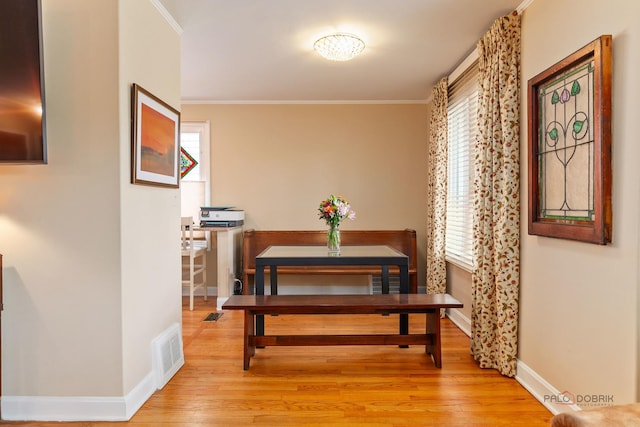 7220 W Ibsen St, Chicago, IL 60631 - dining room featuring healthy amount of natural light, ornamental molding, baseboards, and light wood-type flooring