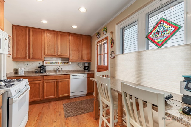 7220 W Ibsen St, Chicago, IL 60631 - kitchen with white appliances, a sink, light wood-style flooring, brown cabinets, and recessed lighting
