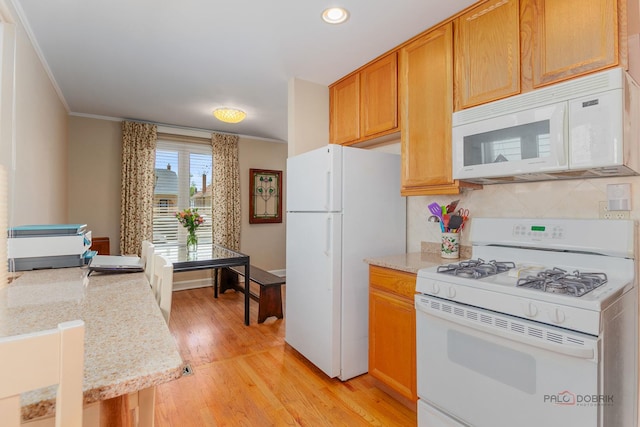 7220 W Ibsen St, Chicago, IL 60631 - kitchen with white appliances, light wood-type flooring, crown molding, recessed lighting, and backsplash