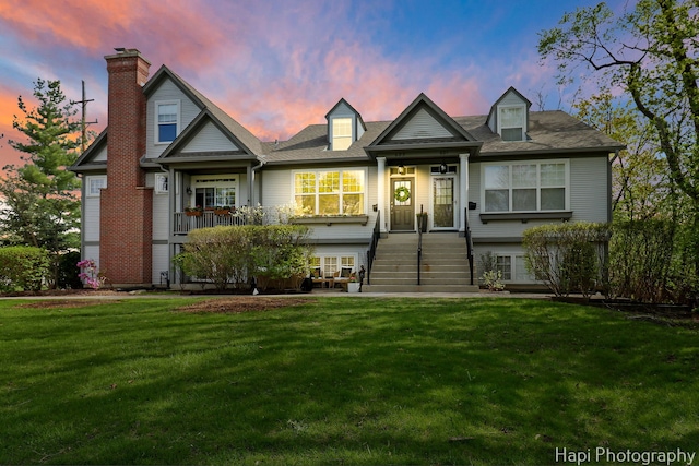 623 Broadway St, Libertyville, IL 60048 - view of front facade with a front lawn and a chimney