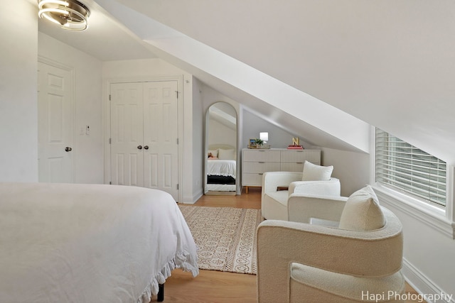 623 Broadway St, Libertyville, IL 60048 - bedroom with baseboards, vaulted ceiling, and wood finished floors