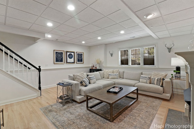 623 Broadway St, Libertyville, IL 60048 - living room featuring recessed lighting, a paneled ceiling, stairway, and light wood-type flooring