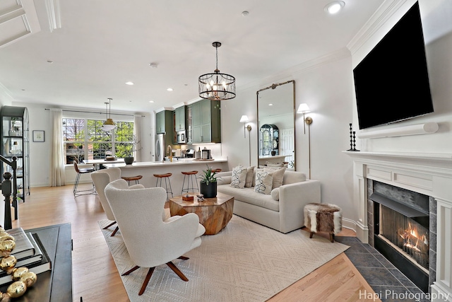 623 Broadway St, Libertyville, IL 60048 - living area with crown molding, recessed lighting, wood finished floors, and a premium fireplace