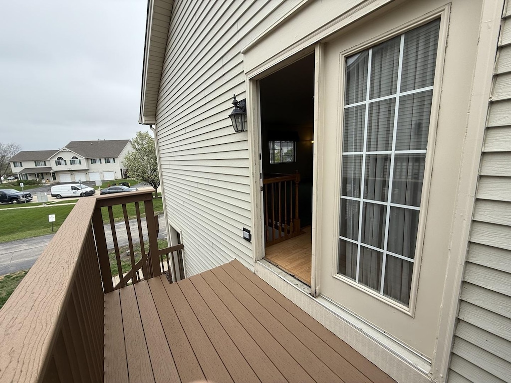 wooden terrace with a residential view