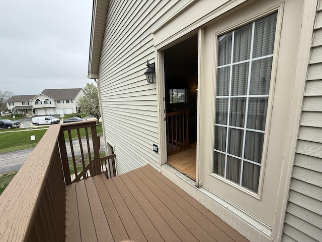 wooden terrace with a residential view