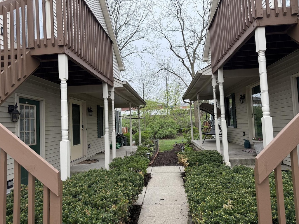 exterior space with covered porch and stairway