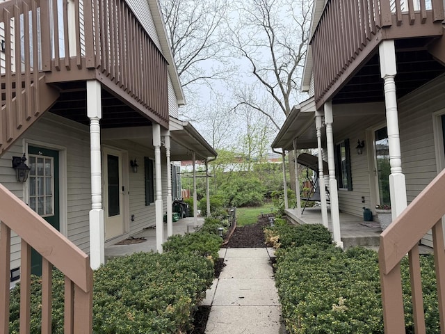 exterior space with covered porch and stairway