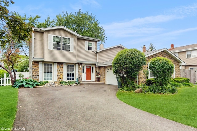 1288 N Ashland Ave, Palatine, IL 60074 - view of front of home featuring asphalt driveway, brick siding, and an attached garage
