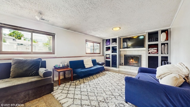 1288 N Ashland Ave, Palatine, IL 60074 - living area featuring a textured ceiling, a tiled fireplace, and ornamental molding