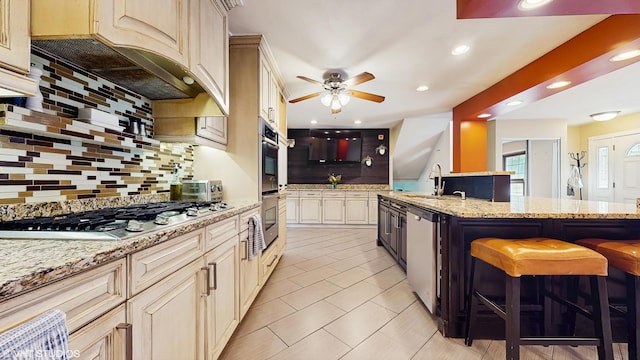 1288 N Ashland Ave, Palatine, IL 60074 - kitchen with appliances with stainless steel finishes, decorative backsplash, a ceiling fan, a kitchen breakfast bar, and light tile patterned flooring