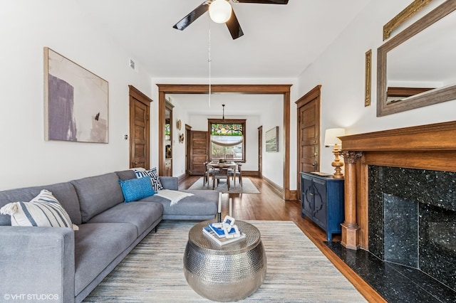 2137 W Cortez St Unit 2, Chicago, IL 60622 - living room featuring dark wood-type flooring, ceiling fan, and a fireplace