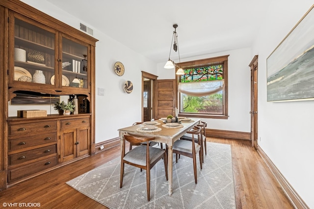2137 W Cortez St Unit 2, Chicago, IL 60622 - dining space featuring wood finished floors and baseboards