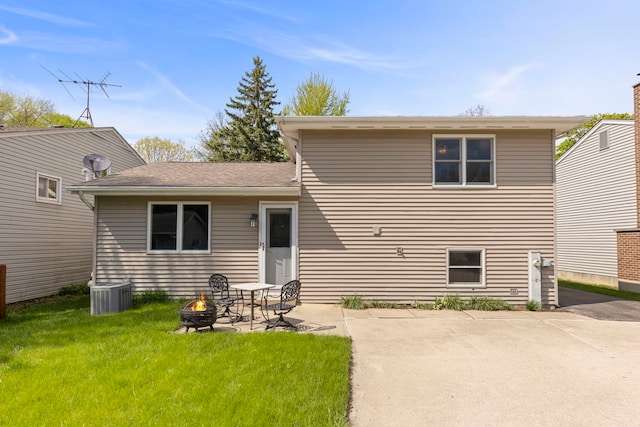 1500 E Lowden Ave, Wheaton, IL 60189 - rear view of property featuring an outdoor fire pit, a lawn, a patio, and central air condition unit