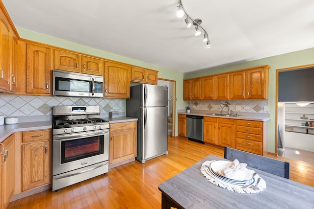 1500 E Lowden Ave, Wheaton, IL 60189 - kitchen featuring appliances with stainless steel finishes, light countertops, and light wood finished floors