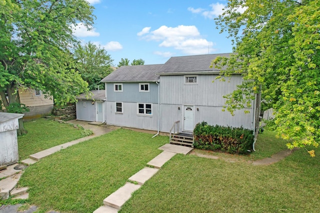 906 E Illinois St, Lemont, IL 60439 - back of property featuring a shingled roof and a yard