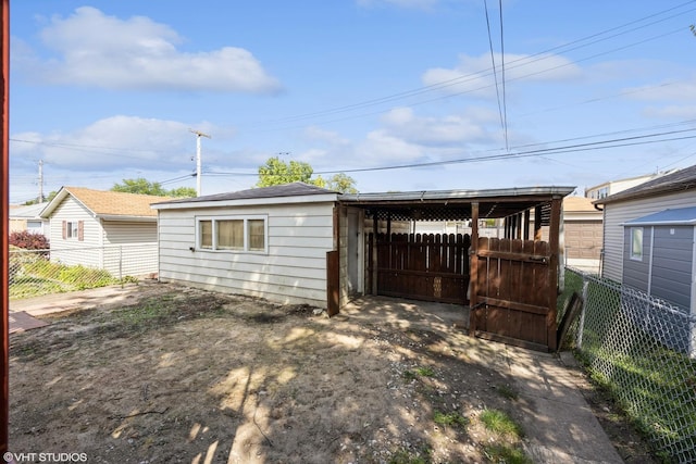 3617 E Ave, Berwyn, IL 60402 - view of outbuilding with a fenced backyard and a carport