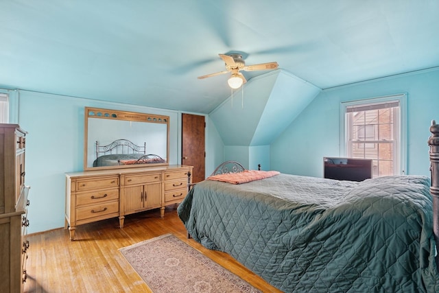 bedroom featuring lofted ceiling, hardwood / wood-style floors, and ceiling fan