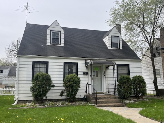156 W 141st St, Riverdale, IL 60827 - new england style home with a chimney and a front yard
