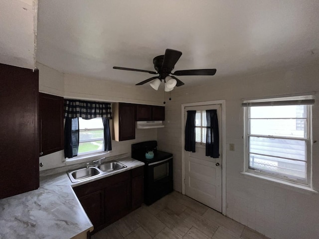 156 W 141st St, Riverdale, IL 60827 - kitchen with a sink, under cabinet range hood, black range with electric stovetop, and a wealth of natural light