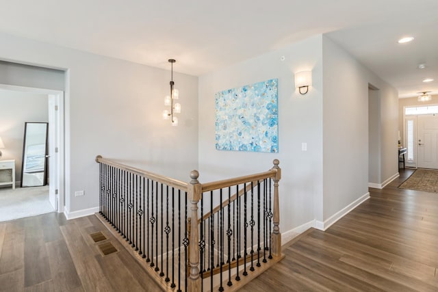 302 Links Dr, Addison, IL 60101 - corridor with wood finished floors, an upstairs landing, baseboards, a chandelier, and recessed lighting