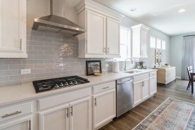 302 Links Dr, Addison, IL 60101 - kitchen featuring wall chimney exhaust hood, appliances with stainless steel finishes, a sink, white cabinetry, and recessed lighting