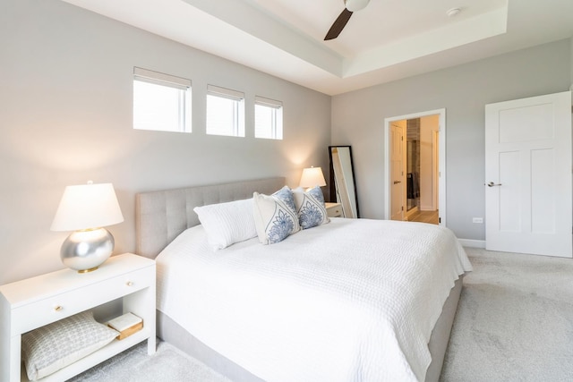 302 Links Dr, Addison, IL 60101 - bedroom with carpet floors, a tray ceiling, and a ceiling fan