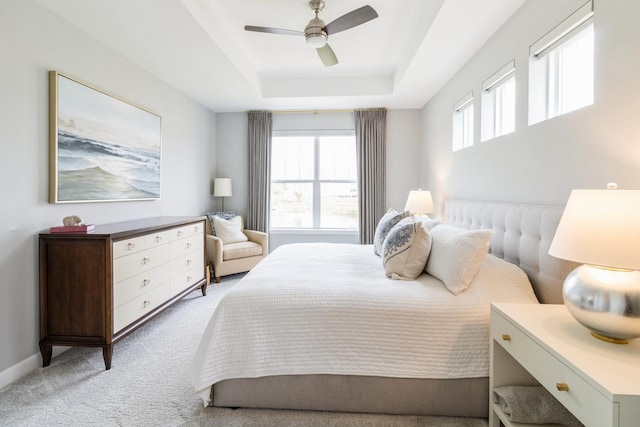 302 Links Dr, Addison, IL 60101 - bedroom with light colored carpet, a raised ceiling, a ceiling fan, and baseboards