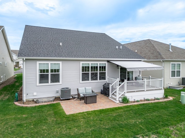 302 Links Dr, Addison, IL 60101 - back of house featuring central air condition unit, a patio area, a shingled roof, a deck, and a lawn