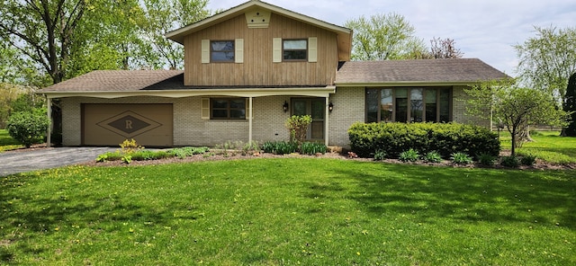 23223 S Volbrecht Rd, Crete, IL 60417 - view of front of home with a garage, brick siding, asphalt driveway, and a front lawn