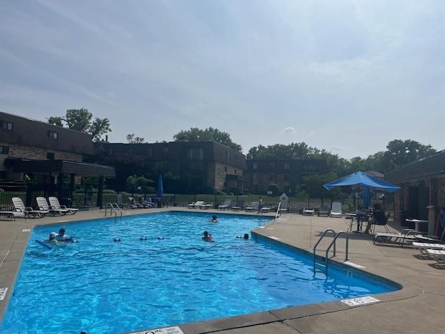 9199 N Rd Unit E, Palos Hills, IL 60465 - community pool featuring a patio